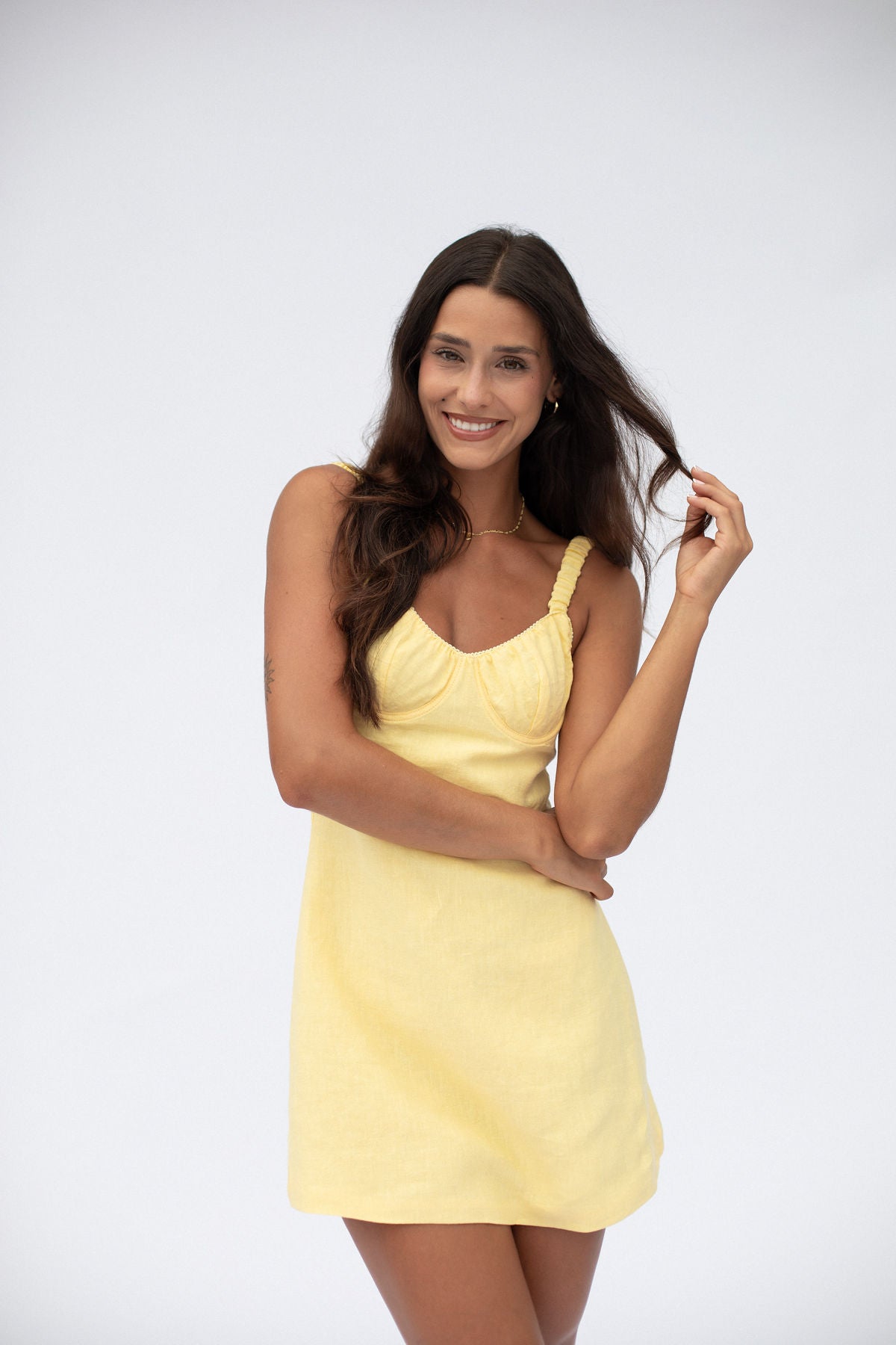 Butter yellow mini summer dress with straps, fitted waist and bust. Designed by Zarfie. Made with linen and cotton.